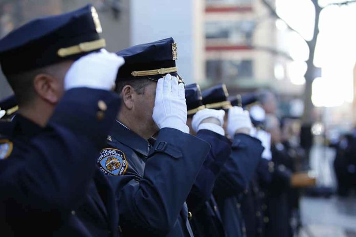 shutterstock_354123707 uniformed police officers salute in formation outdoors