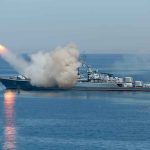 Warship launching a missile at sea