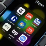 New York Times Hit With SURPRISE Shareholder Lawsuit News app icons on a smartphone screen.
