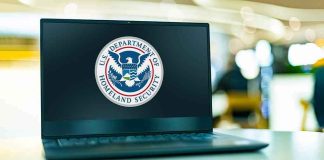 Laptop displaying U.S. Department of Homeland Security logo.