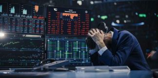 Trader stressed out by multiple declining stock charts.