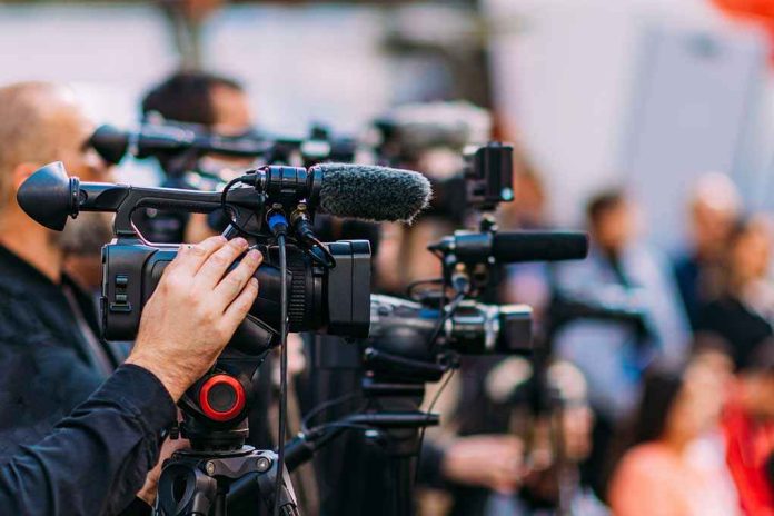 default-hero-04 Video cameras on tripods at a media event