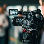 52 Second On-Air Comment Got CBC Reporter Pulled Video camera filming a group of people