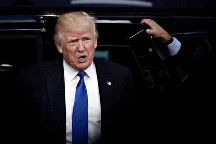 shutterstock_1045903501 Donald Trump stepping out of a vehicle in a suit and blue tie