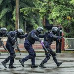 San Diego Votes to Kick ICE OFF Local Firing Ranges! Police tactical team advancing in rain