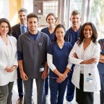 Fauci Subpoenaed Over Alleged COVID Profits Group of healthcare professionals posing in a hospital corridor