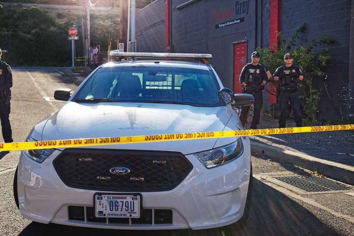 Police car behind yellow caution tape on a city street