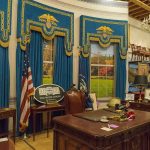 Oval Office-style desk and decor in a museum display