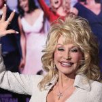 Dolly Parton waving at an event