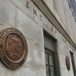 Iran Cash Becomes Trump’s Wild Card U.S. Treasury building exterior with bronze seal on stone wall