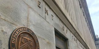 U.S. Treasury building exterior with bronze seal on stone wall