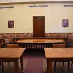 Chilling 911 Audio Freezes Courtroom Empty courtroom with wooden tables and gallery seating