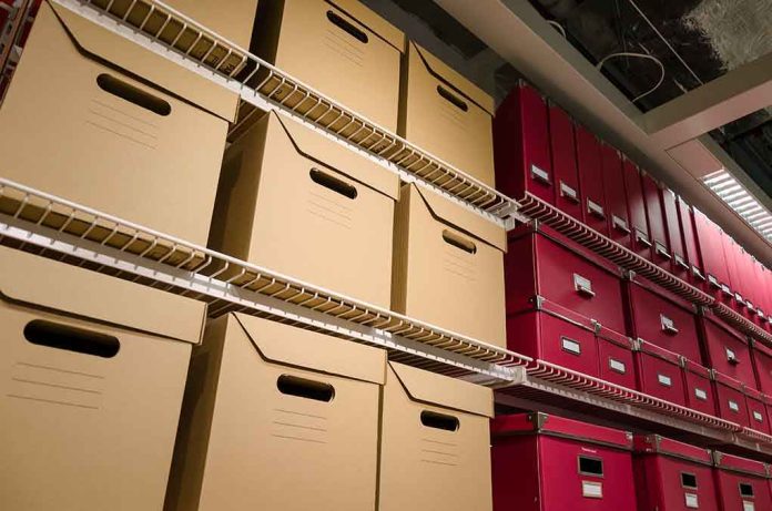 shutterstock_133401359 Shelves filled with brown and red storage boxes for organizing documents