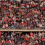 Peter Keys in a large stadium crowd of football fans