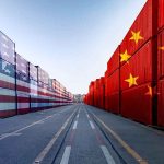 U.S. and China Quietly Cut THESE Tariffs Shipping containers painted with US and China flags facing each other along a port lane