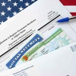 ANOTHER Illegal Alien Murderer in VA immigration forms with green card and social security card on US flag background