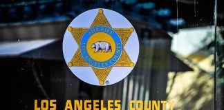 Los Angeles County Sheriff emblem on a glass door