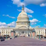 Trump Turning DC Arch Into Sniper-Armed Military Complex United States Capitol building under a bright blue sky