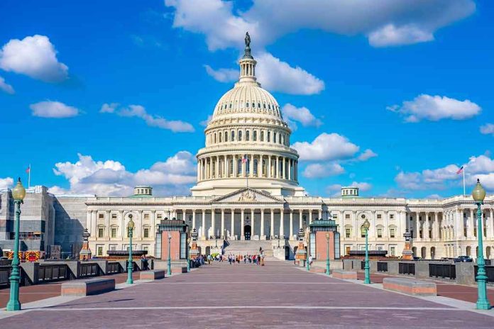 shutterstock_1671025258-1 United States Capitol building under a bright blue sky