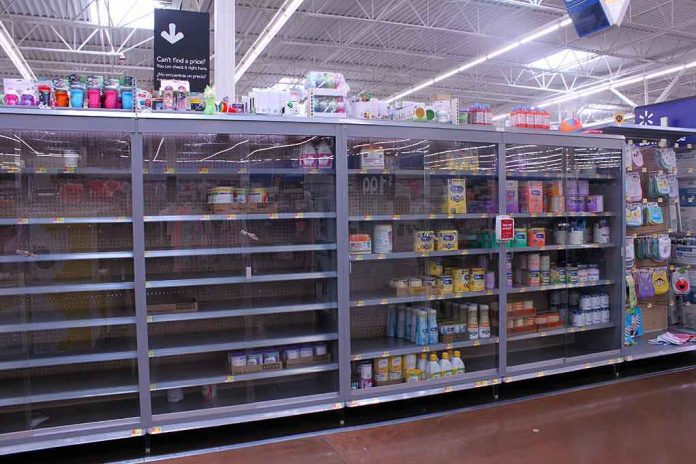 Partially empty store shelves with baby formula and supplies