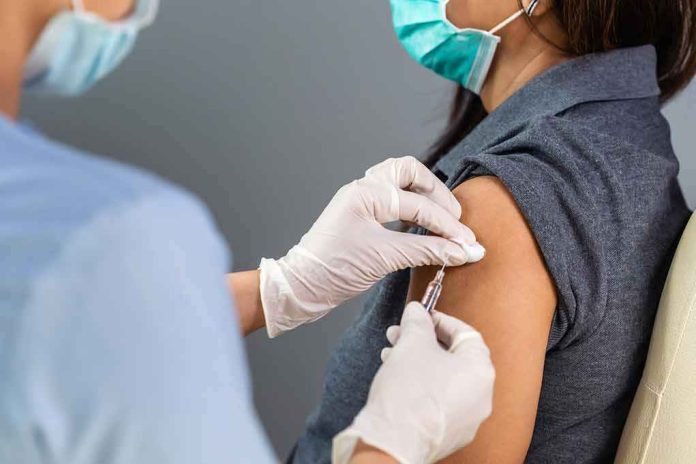 Healthcare worker administers vaccine to patient’s upper arm