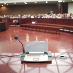 Pastor Says Dearborn Is ‘Under SHARIA LAW!’ Conference microphone on a podium in a courtroom