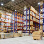 How Ukraine’s Drone War Is Crippling ‘Russia’s Amazon’ Warehouse aisles with tall blue and orange pallet racks filled with boxes