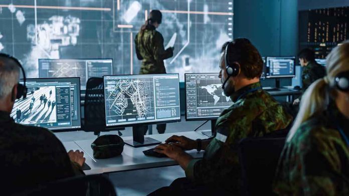 Military analysts at computers in a command center