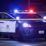 Bathroom Threat Triggers TERROR Sweep Police SUV with flashing lights at night behind yellow tape