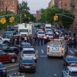 Teens Swarm Cop—Truth Still Hidden Police vehicles and officers block a city street during an active scene
