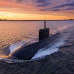 How 1 Worker Cost the Navy $700 MILLION Submarine cruising on the surface at sunset