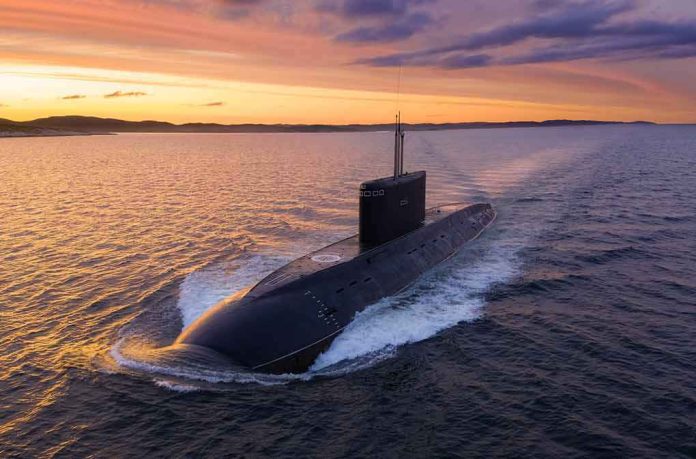 shutterstock_2007289679 Submarine cruising on the surface at sunset