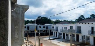 Row of newly built townhouses on a construction site