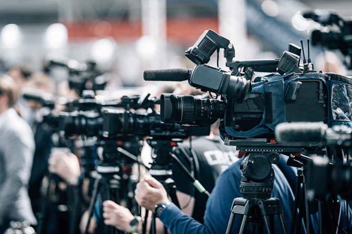 shutterstock_2197858977 Broadcast cameras on tripods at a press event