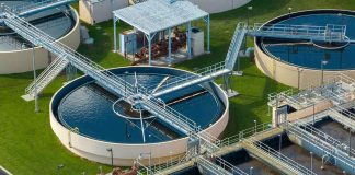 Wastewater treatment plant with circular clarifiers and aeration tanks