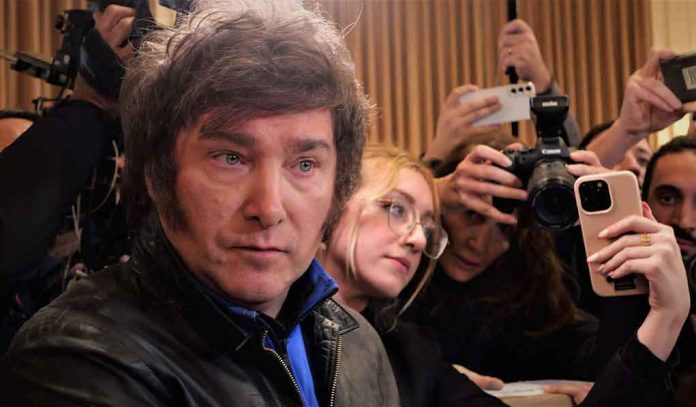 Man surrounded by reporters with cameras and phones
