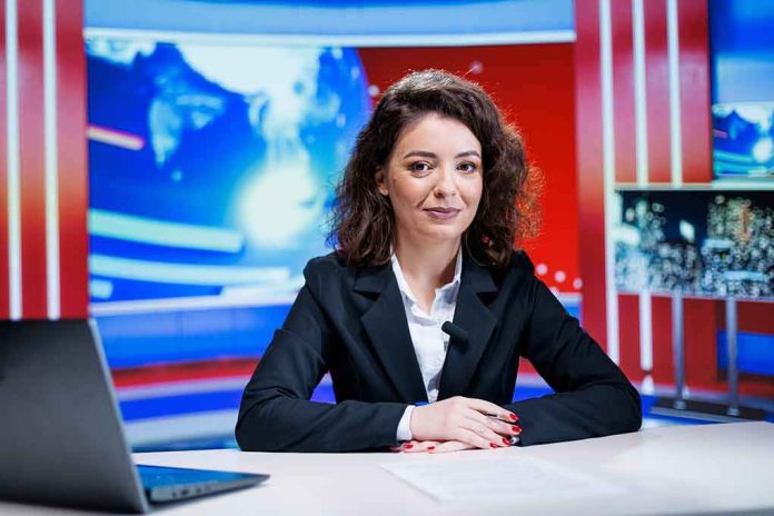 shutterstock_2550477051 News anchor seated at a broadcast desk
