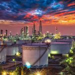 Drone Barrage Rattles Crimea Control Oil refinery with storage tanks at sunset