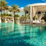 Resort pool with cabana and palm trees
