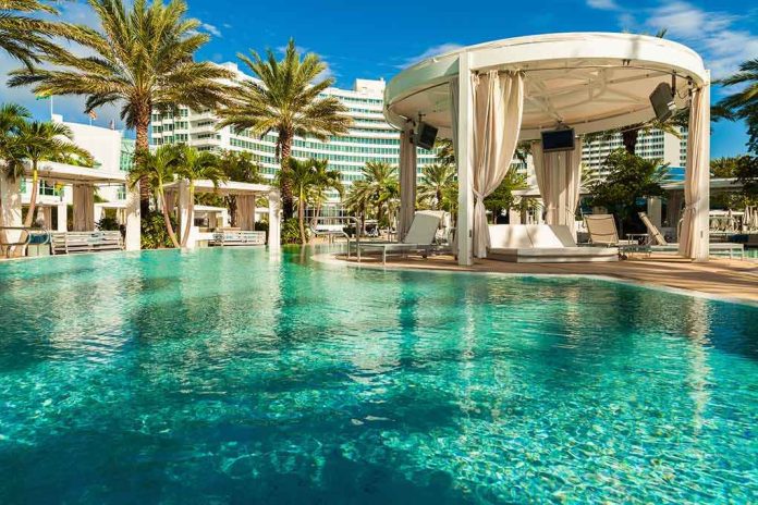 Resort pool with cabana and palm trees