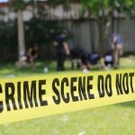 3 Mass Shootings Erupt Across America Within Hours crime scene tape cordoning off a grassy area
