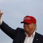 Trump Says ‘NOT POSSIBLE’ for Black or Jewish Voters to Vote Democrat Donald Trump waving in a red cap