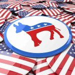Mark Kelly Torches ‘Abolish’ Push Democratic donkey symbol on a campaign button