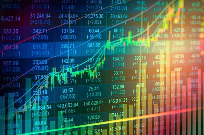 shutterstock_416888221-1 Stock market chart with rising candlesticks and trend lines