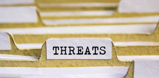 index tab labeled threats in a filing organizer