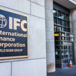 Taxpayer Biolab Bombshell — 120 Overseas Sites IFC plaque on building exterior near glass entrance