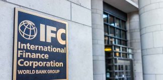 IFC plaque on building exterior near glass entrance