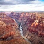 Grand Canyon with river winding through layered red cliffs