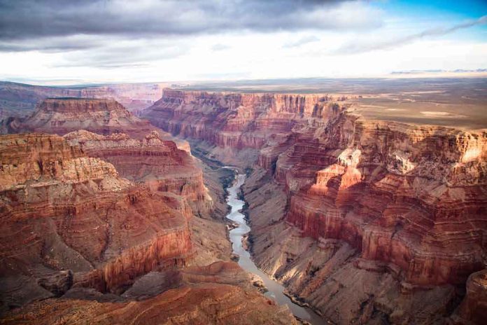 shutterstock_652472320 Grand Canyon with river winding through layered red cliffs