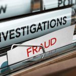 File folders labeled investigations and fraud in a filing cabinet